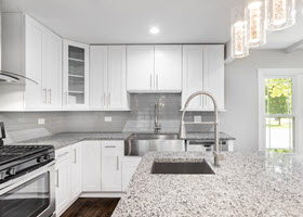 White Kitchen With Granite Countertops
