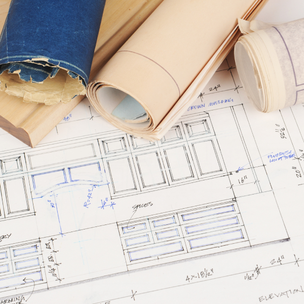 Blueprints of a kitchen remodel with new cabinetry and countertops.